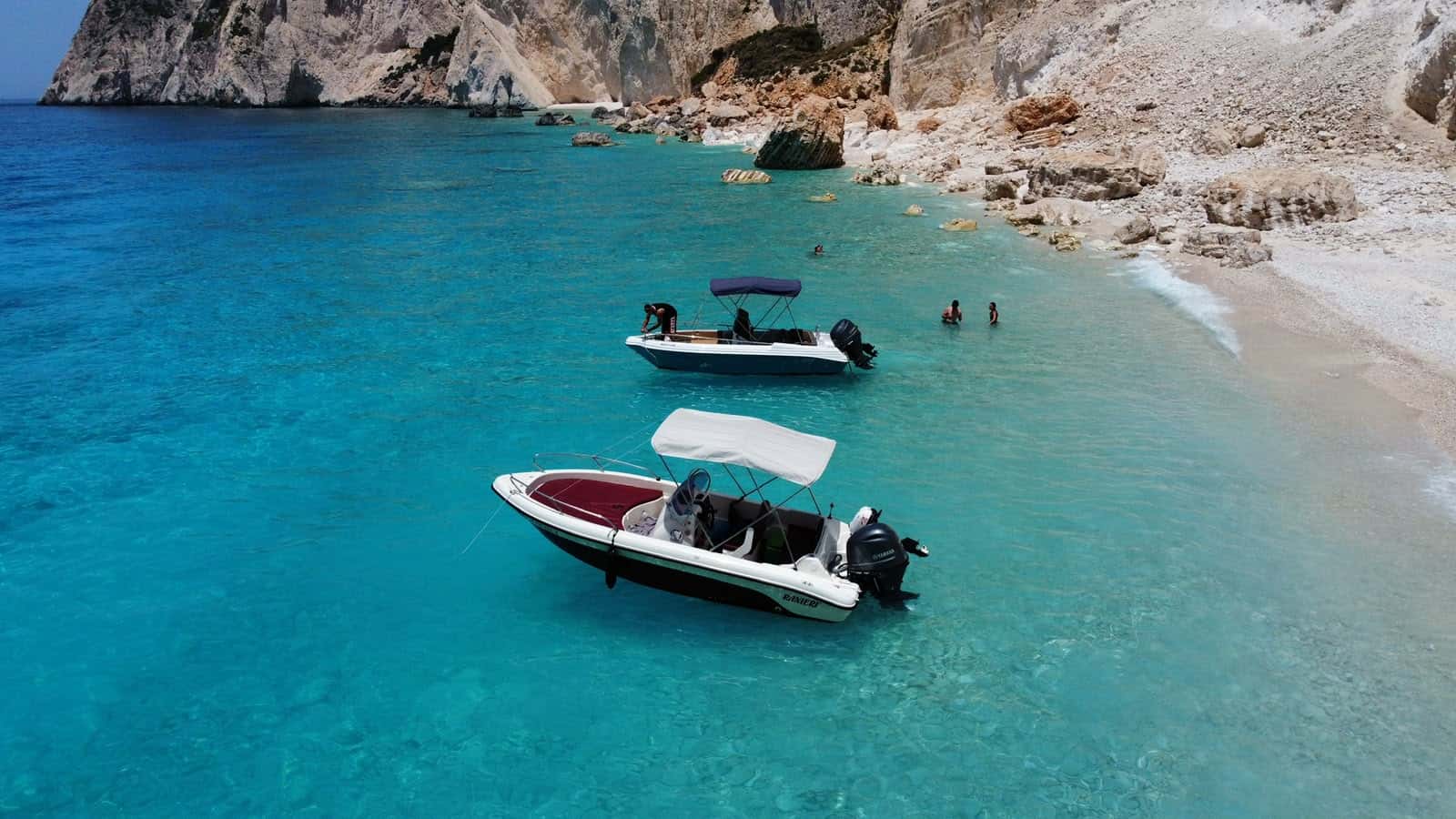 Mateo anchored over bright turquoise water, seen from above