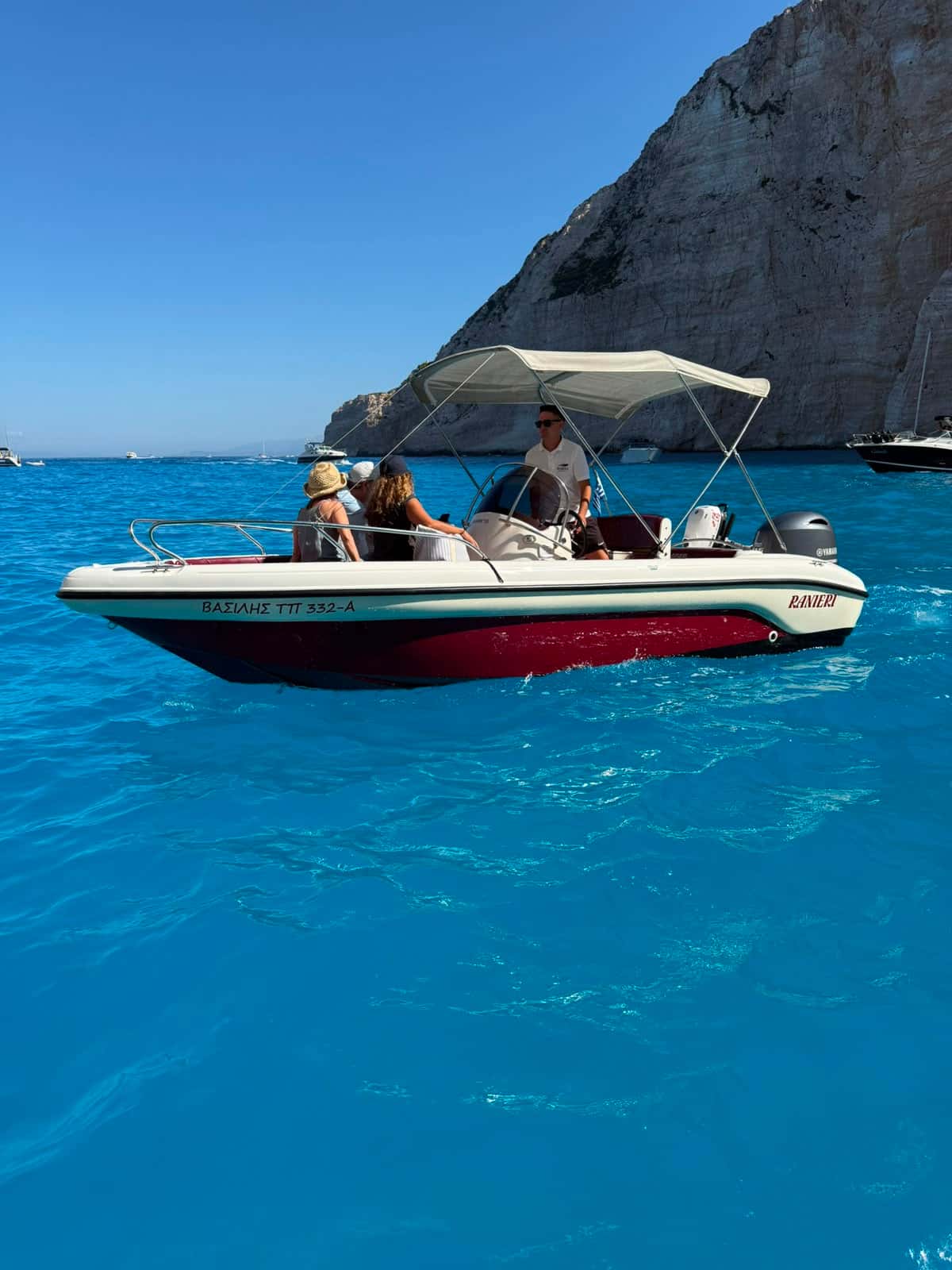 Guests aboard Mateo beneath the Navagio cliffs