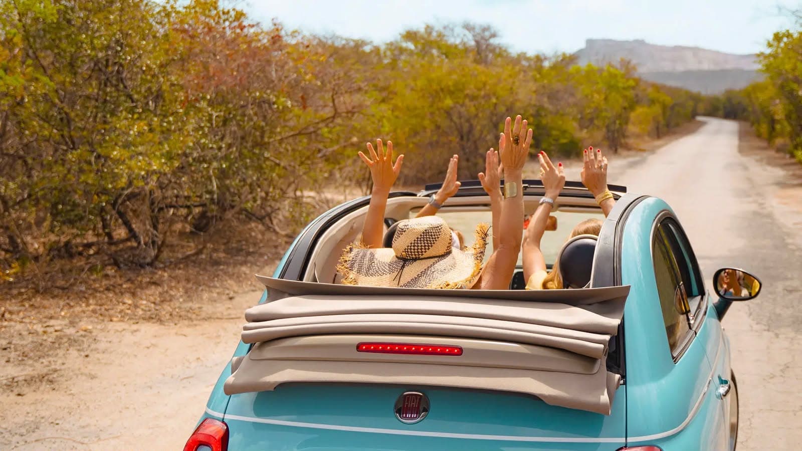 Open-top rental car on a scenic Zakynthos road
