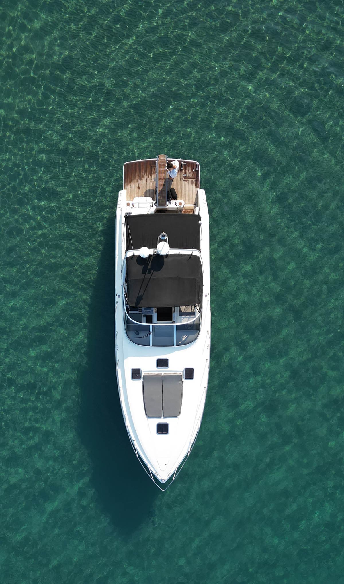 Fortuna luxury VIP yacht from above on deep green water